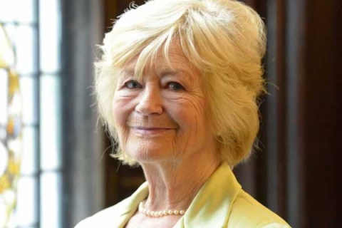 Yvonne Moores headshot smiling to camera