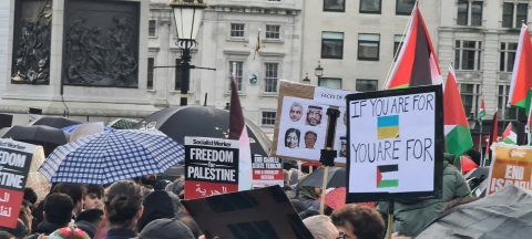 A crowd of people holding up signs demonstrating - Photo by Austin Crick on Unsplash
