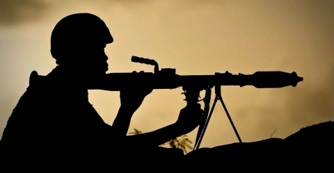 Silhouette of soldier with rifle