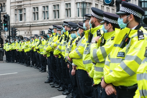 Police officers lined up - Photo by Ehimetalor Akhere Unuabona on Unsplash