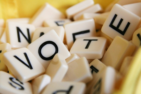 Scrabble tiles spelling vote