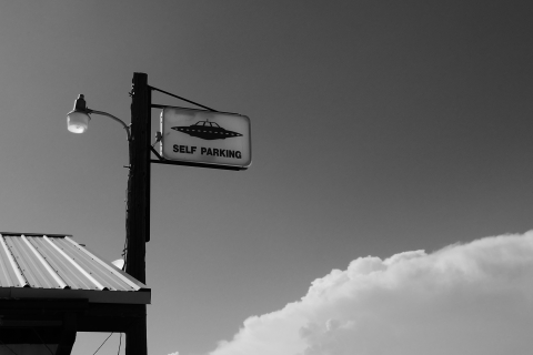 Sign with UFO parking on it - Photo by Michael Herren on Unsplash