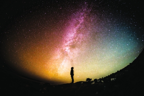 Man stargazing at night silhouette 