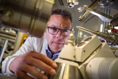 Professor John McGeehan working with lab equipment