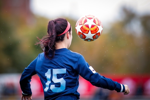 women playing football - Photo by Rhett Lewis on Unsplash