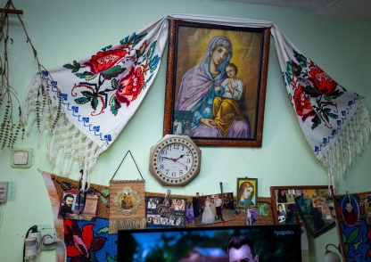 a photo of religious paintings and items inside a house by paul coman