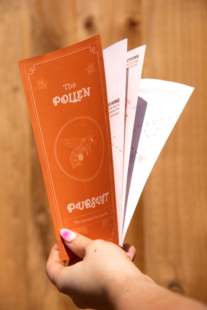 orange book about pollen and  bees