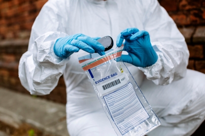 Forensics student puts crime evidence in bag