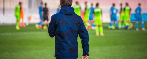Football head trainer during professional soccer match