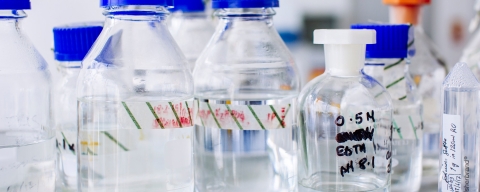 beakers and bottles containing a clear liquid