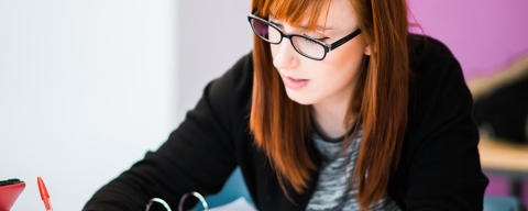 University of Portsmouth student studying and writing