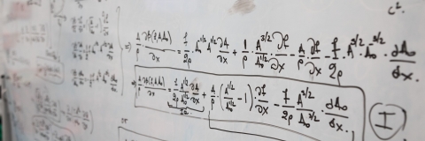 Mathematical equations on a whiteboard