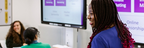 Tara Goddard speaking at a seminar