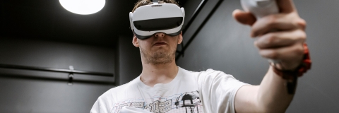 Student wearing a VR headset as the CCIXR centre