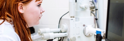 Female student  on computer in biology lab