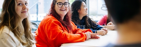 A group of four female students in a tutorial session