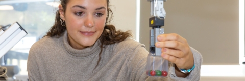 Female student working in the Robotics lab