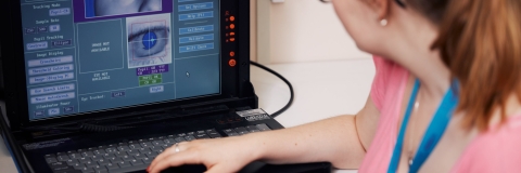 Psychology conducting eye exam