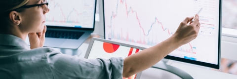woman pointing at graph with pencil