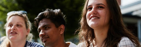 Three students in conversation 