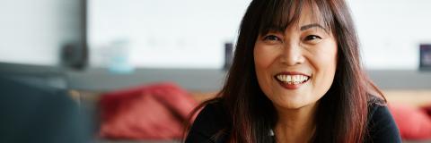 woman smiling during course in university cafe