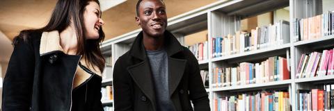 two students from algeria in university of Portsmouth library
