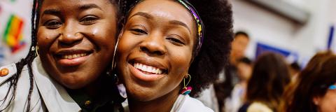Smiling students posing for photo in Students' Union Third Space