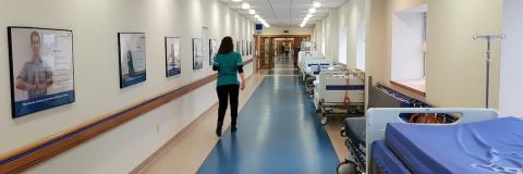 Healthcare worker in hospital corridor