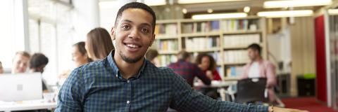 Sanctuary scholarship student in library