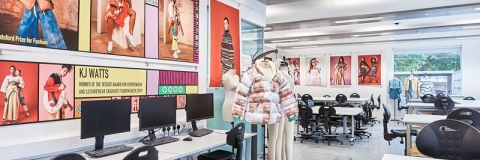 Fashion and Textile Design teaching and learning space featuring desks, chairs, computers, student work and posters