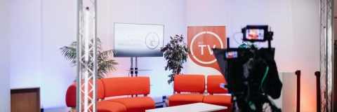 A film set with sofas and screens