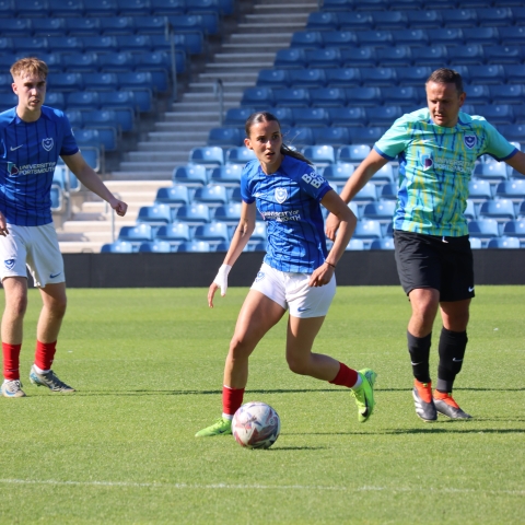 Three footballers playing at Fratton Park