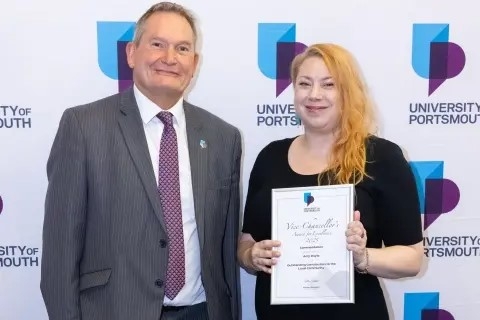 Headshot of Amy Doyle smiling with vice chancellor