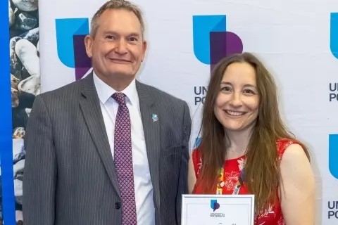 Headshot of Amy Hopkins smiling with the vice chancellor