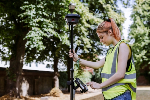 Student uses measurement device outside of Technology Facilities