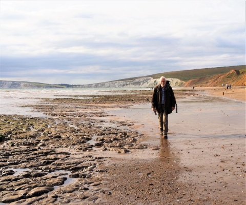 Dr Jeremy Lockwood walking in Compton Bay