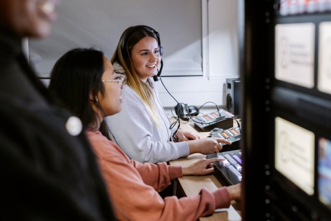 Two students working together in CCI TV Studio Gallery.