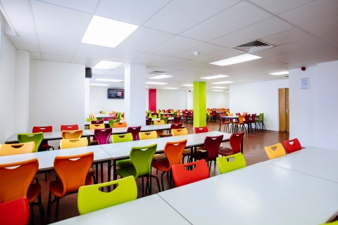 Tables and seats in cafeteria of Rees Hall, Portsmouth