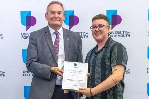 Headshot Hayden Slight with vice chancellor smiling