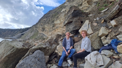 Dr Roy Smith and University of Portsmouth student Ben Weston by the flint bed in Durlston Bay near Swanage, which is the layer of rock which the mammal fossil came out of