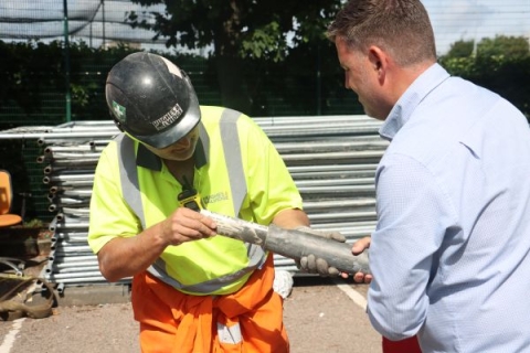 Demolition Site Manager Nathan Byng opening the time capsule