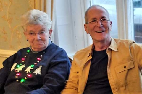 Jools and Jon smiling to camera on their golden anniversary celebrations