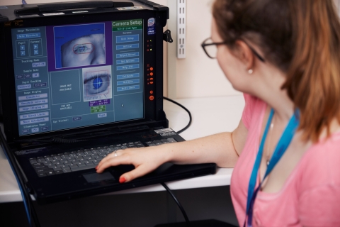 Psychology conducting eye exam