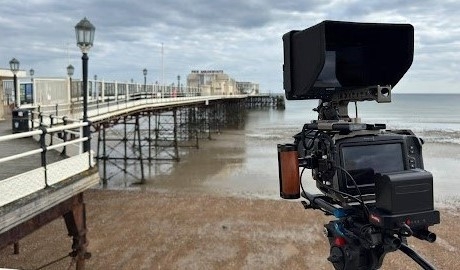 Camera taking picture of pier 