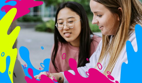 Two female students viewing a webinar