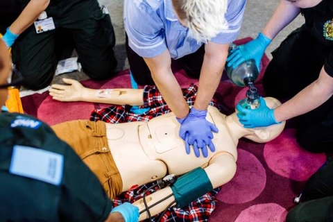 Nursing students working with a medical manikin in our Simulation Centre