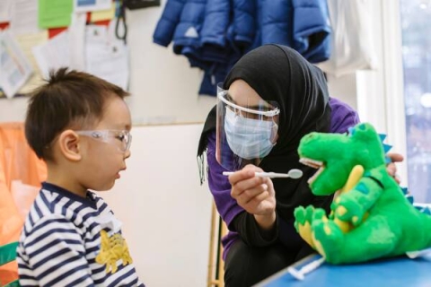 A member of the dental academy demonstrating good brushing technique 