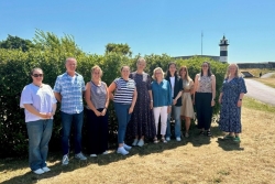 Group photo of PhD students stood by Southsea Castle