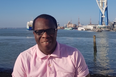Andrew Nomoja in front of the Spinnaker Tower