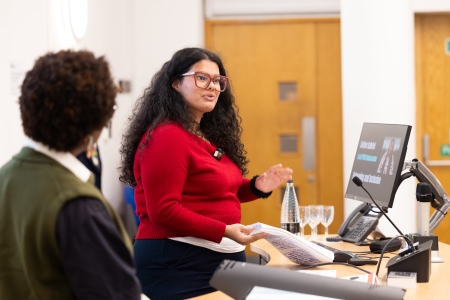 Solène Gabriel presenting at a lectern 